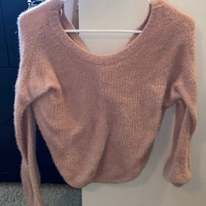 Super cute bubbly pink sweater that has an open twist back
